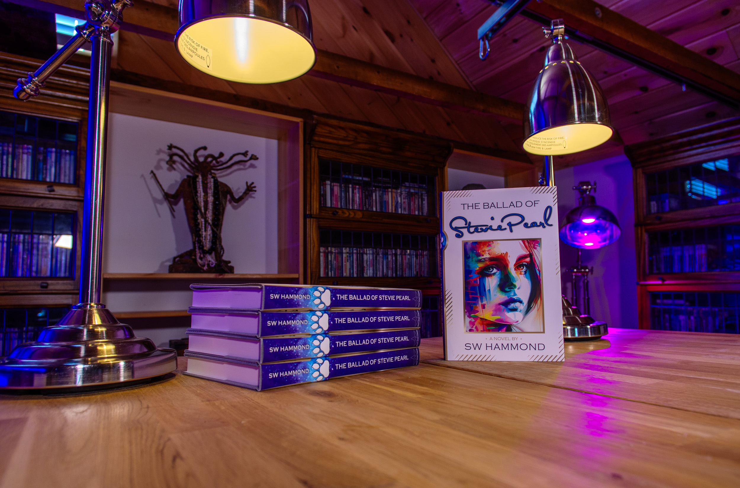 Photograph of The Ballad of Stevie Pearl. A stack of hardcover books with a book standing on end to show its cover.