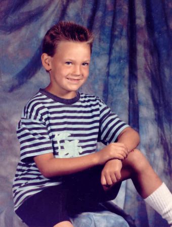 SW Hammond elementary school picture, 1990s. Spiked hair, neon shirt, and sweet white socks.